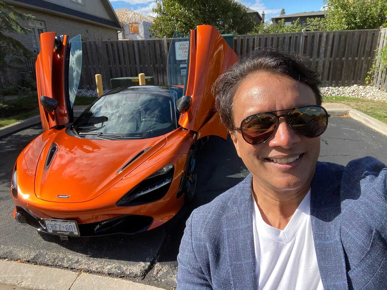 Author posing with a volcano orange McLaren 720S